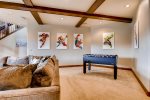 Foosball, Playstation, and other games in this entertainment den